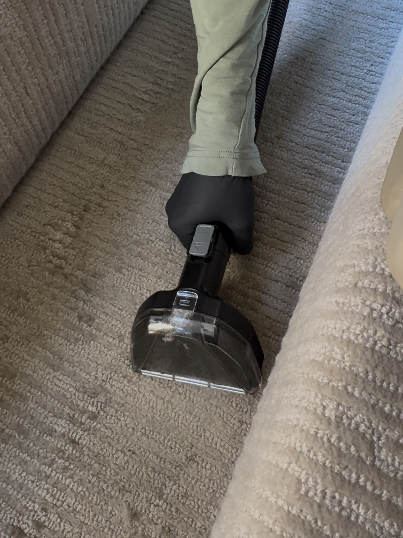 Professional aircraft carpet shampoo and stain removal service — steam cleaning carpet inside luxury private jet cabin